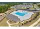 Aerial view of neighborhood pool with a bathhouse, deck, and lane pool at 6113 Russo Ct, Lancaster, SC 29720