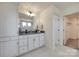 Bright bathroom featuring white vanity and connecting walk-in closet at 6113 Russo Ct, Lancaster, SC 29720