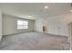 Spacious bedroom features plush carpeting, bright window and ensuite bathroom access at 6113 Russo Ct, Lancaster, SC 29720