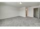Large bedroom with neutral walls and carpet, along with an ensuite bathroom, providing ample space for relaxation and comfort at 6113 Russo Ct, Lancaster, SC 29720