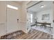 Bright foyer featuring wood floors, a white front door, and an open view of the office at 6113 Russo Ct, Lancaster, SC 29720
