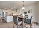 This shows a spacious kitchen and dining area with new, stainless steel appliances and gorgeous countertops at 6113 Russo Ct, Lancaster, SC 29720