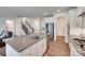 Bright, modern kitchen with a large island, stainless steel appliances, and hardwood floors at 6113 Russo Ct, Lancaster, SC 29720