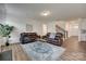 A shot of the well-decorated living room featuring hardwood floors and two leather sofas at 6113 Russo Ct, Lancaster, SC 29720