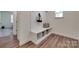 Mudroom area with coat hooks, a storage bench, and natural light from the window at 6113 Russo Ct, Lancaster, SC 29720