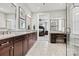Spacious bathroom features double sink vanity, granite counters, and lots of light at 7549 Short Putt Ct, Charlotte, NC 28215