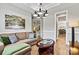 Inviting living room features a comfortable sofa, stylish coffee table, and art, creating a relaxing atmosphere at 7549 Short Putt Ct, Charlotte, NC 28215