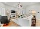 Spacious living room featuring a fireplace, hardwood floors, and ample seating for entertaining at 7549 Short Putt Ct, Charlotte, NC 28215