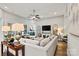Bright and airy living room featuring a fireplace, neutral tones, and access to a patio at 7549 Short Putt Ct, Charlotte, NC 28215
