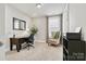 Well-lit home office featuring a desk, chair, and neutral decor, creating a productive workspace at 7549 Short Putt Ct, Charlotte, NC 28215