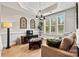 Comfortable sitting room with large windows, plush seating, and stylish decor elements at 7549 Short Putt Ct, Charlotte, NC 28215