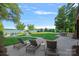 Serene backyard with manicured lawn, lounge chairs, and stunning lake vistas for ultimate relaxation at 7861 Live Oaks Dr, Denver, NC 28037