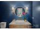 Stylish bathroom with a wood vanity, shiplap walls, and modern fixtures at 7861 Live Oaks Dr, Denver, NC 28037