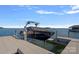 Boat lift and covered boat, providing convenient and protected storage for your watercraft at 7861 Live Oaks Dr, Denver, NC 28037