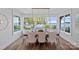 Dining room with water views featuring many windows, and a large table with seating for eight at 7861 Live Oaks Dr, Denver, NC 28037
