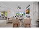 Open living room with lake views, fireplace and TV, featuring hardwood floors and comfortable furnishings at 7861 Live Oaks Dr, Denver, NC 28037