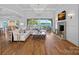 Elegant living room with coffered ceilings, fireplace, and expansive lake views at 7861 Live Oaks Dr, Denver, NC 28037
