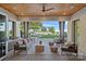 Inviting patio with comfortable seating and scenic lake views, ideal for relaxation and outdoor living at 7861 Live Oaks Dr, Denver, NC 28037