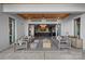 Elegant patio with plush seating and an indoor/outdoor bar, perfect for entertaining guests at 7861 Live Oaks Dr, Denver, NC 28037