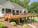 Spacious back deck with outdoor seating, perfect for entertaining and enjoying the serene surroundings at 7927 Fairmont Dr, Waxhaw, NC 28173