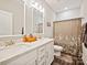 Bright bathroom featuring a double sink vanity with white cabinets and an enclosed shower at 7927 Fairmont Dr, Waxhaw, NC 28173