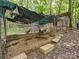 Rustic chicken coop nestled in the woods, providing a natural and safe environment for poultry at 7927 Fairmont Dr, Waxhaw, NC 28173