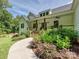 Inviting two-story farmhouse-style home with a cozy front porch and meticulously landscaped yard at 7927 Fairmont Dr, Waxhaw, NC 28173