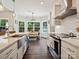 Bright kitchen with stainless steel appliances, granite countertops, and a view to the dining area at 7927 Fairmont Dr, Waxhaw, NC 28173