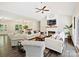 Living room features a cozy fireplace, modern furniture, and an open view to the dining area and kitchen at 7927 Fairmont Dr, Waxhaw, NC 28173