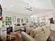 Spacious open-concept living room leading to a modern kitchen with large windows for natural light at 7927 Fairmont Dr, Waxhaw, NC 28173