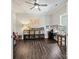 Bright office space featuring hardwood floors, and ample shelving for organized storage at 7927 Fairmont Dr, Waxhaw, NC 28173