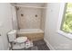 Bathroom showcasing a bathtub and tiled shower with neutral tones at 85 Riley Dr, Taylorsville, NC 28681
