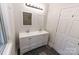 Bathroom with double sinks, modern lighting, and stylish fixtures at 85 Riley Dr, Taylorsville, NC 28681