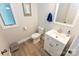Clean bathroom with white vanity, modern fixtures, and tile floors at 85 Riley Dr, Taylorsville, NC 28681