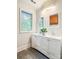 Bathroom with double sink vanity, ample storage, and a view from the window at 85 Riley Dr, Taylorsville, NC 28681