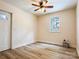Neutral bedroom with light walls, a ceiling fan, and natural light from a window at 85 Riley Dr, Taylorsville, NC 28681