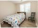 Bedroom features laminate wood flooring, natural lighting, and a cozy bed at 85 Riley Dr, Taylorsville, NC 28681