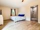Inviting bedroom with a large bed, ample natural light, and ensuite tiled shower at 85 Riley Dr, Taylorsville, NC 28681