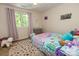 Bright bedroom with laminate wood flooring and a large window with natural light at 85 Riley Dr, Taylorsville, NC 28681