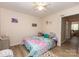Bedroom with laminate wood flooring, artwork and comfortable bed at 85 Riley Dr, Taylorsville, NC 28681