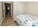 Comfortable bedroom features wood flooring and a charming decorative quilt at 85 Riley Dr, Taylorsville, NC 28681