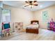 Comfortable bedroom with natural light, ceiling fan, and cheerful décor and furnishings at 85 Riley Dr, Taylorsville, NC 28681