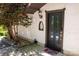 Home's front door with sidelights, a welcome mat, and exterior lighting and stonework at 85 Riley Dr, Taylorsville, NC 28681