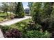 Traditional home with an extended driveway surrounded by lush landscaping at 85 Riley Dr, Taylorsville, NC 28681