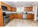 Well-equipped kitchen with stainless steel appliances and a garden view at 85 Riley Dr, Taylorsville, NC 28681