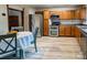 Well-lit kitchen equipped with stainless steel appliances, wooden cabinets, and tile backsplash at 85 Riley Dr, Taylorsville, NC 28681