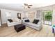 Bright living room with hardwood floors, neutral-toned furniture, and open floorplan at 85 Riley Dr, Taylorsville, NC 28681