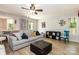 Bright living room with hardwood floors, neutral-toned furniture, and lots of natural light at 85 Riley Dr, Taylorsville, NC 28681
