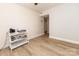 Neutral room with a small white shelving and wood-look floors at 85 Riley Dr, Taylorsville, NC 28681