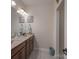 Bathroom features a double sink vanity with elegant fixtures and coastal-themed decorations at 866 Tyne Dr, Fort Mill, SC 29715